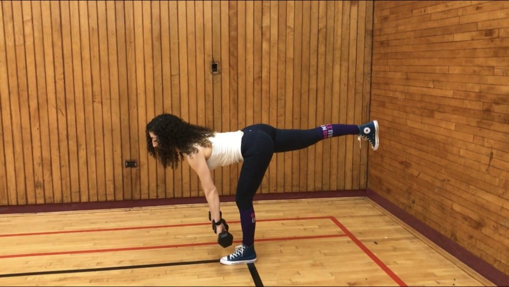 brittany bending at the hips and bringing her torso parallel to the ground on one leg