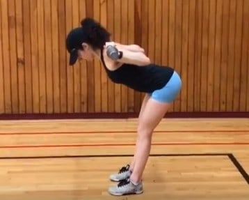brittany at the bottom position of the goodmorning- her hips pushed back and upper back parallel to the floor in a neutral position and knees straight