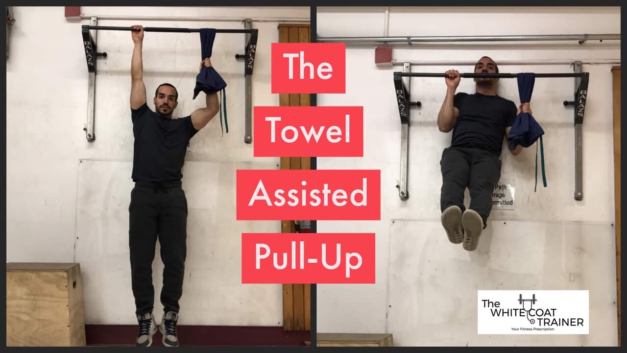 towel-assisted-pull-up-exercise: alex doing a pullup with one hand on the bar, the other hand pulling a towel draped across the bar