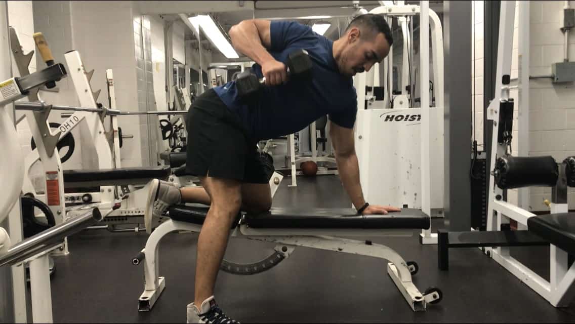 incorrect dumbbell row form - pulling the weight way too high above your chest level