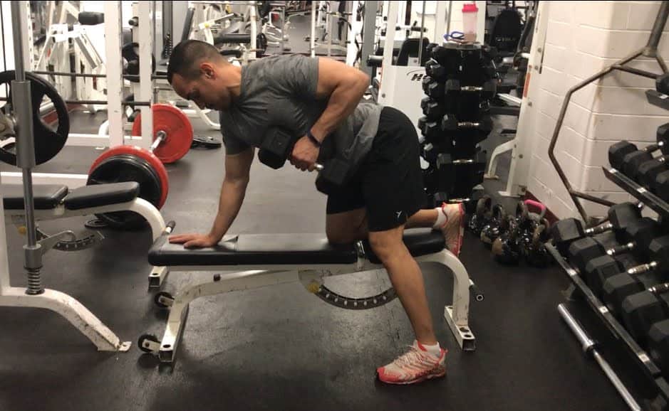 dumbbell row exercise from a bent over position on a bench