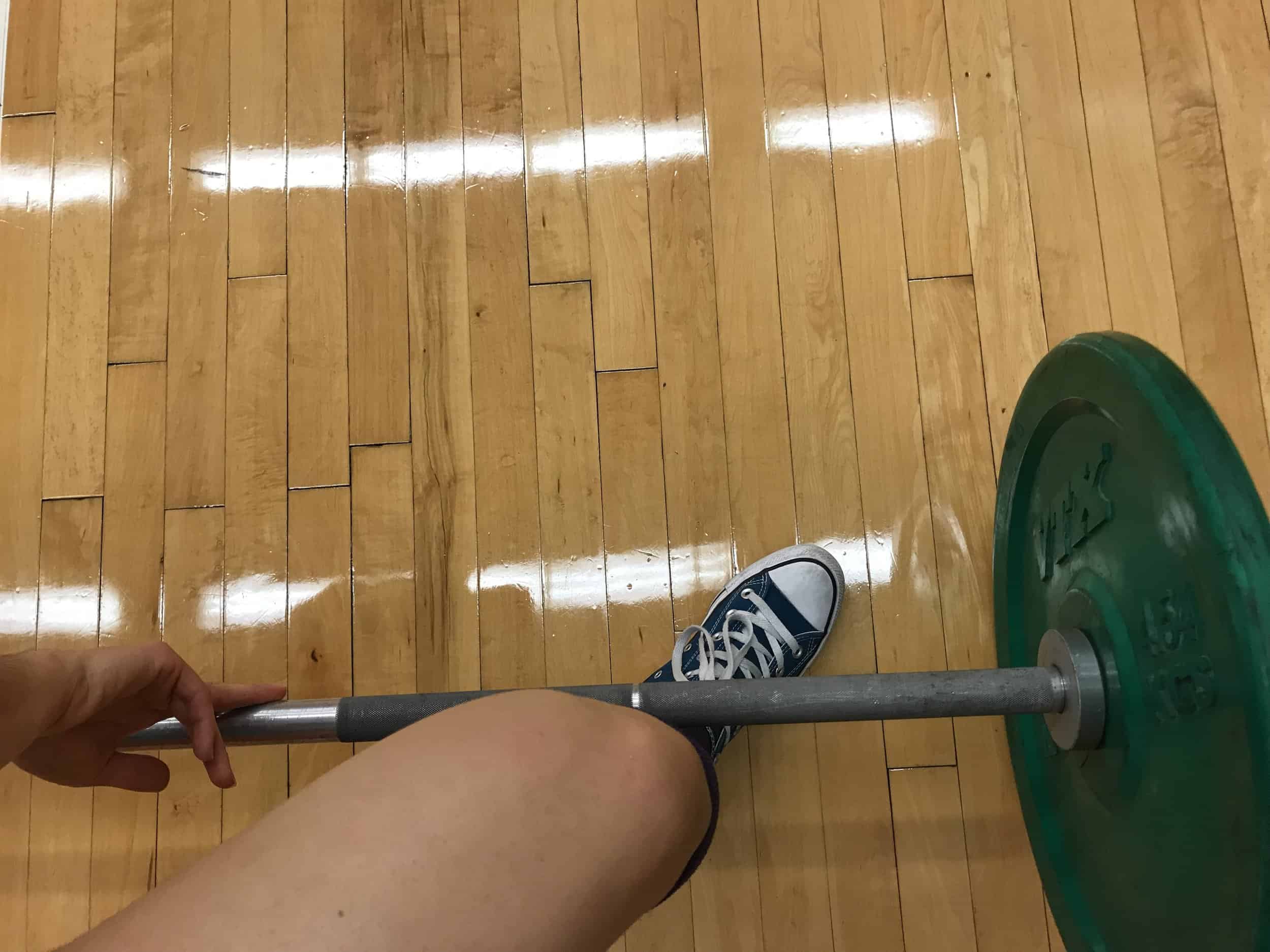 top view of brittanys knee perfectly in line with her toes at the bottom of the sumo deadlift position