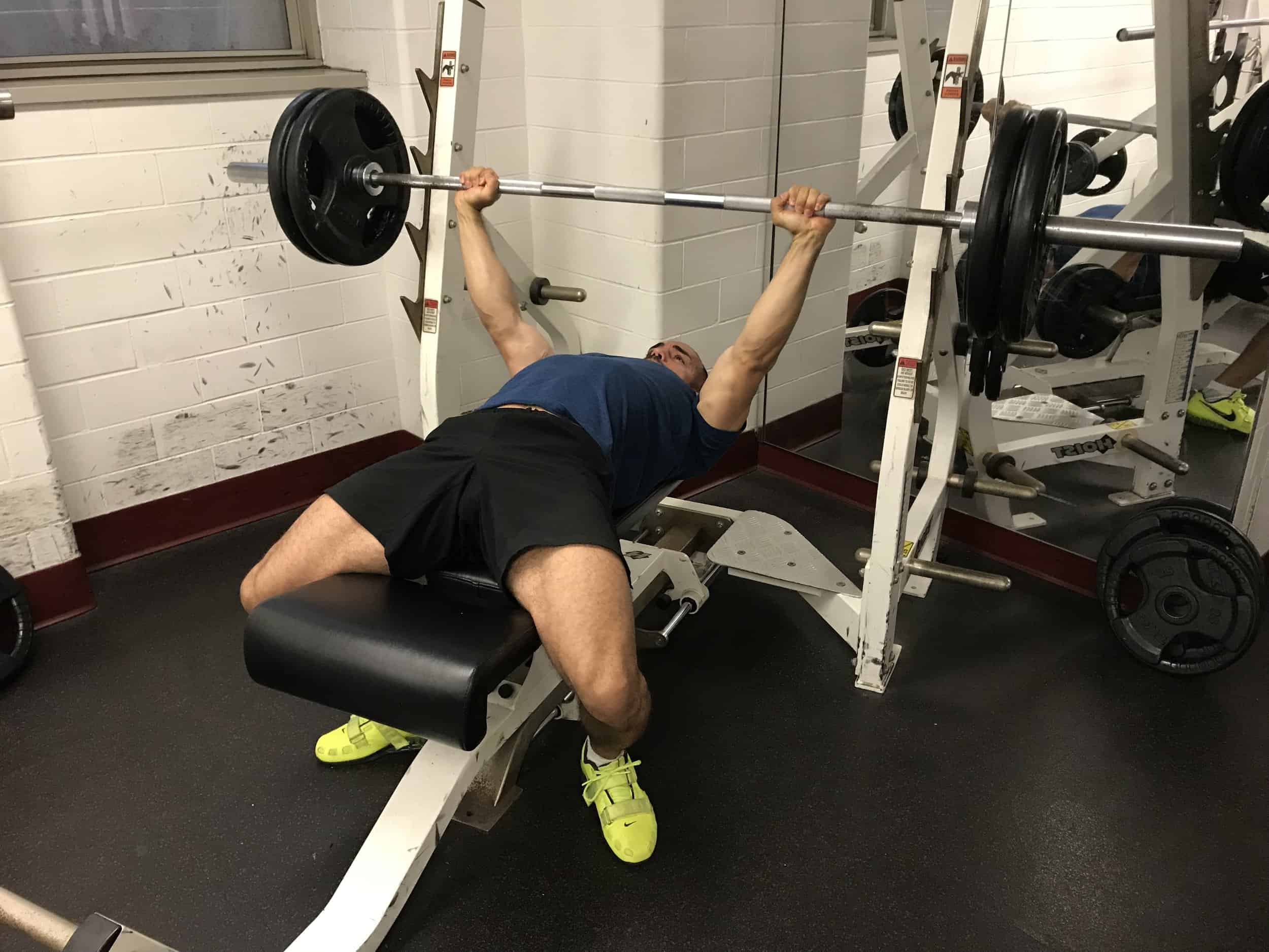 alex-doing-bench-press-exercise on his back