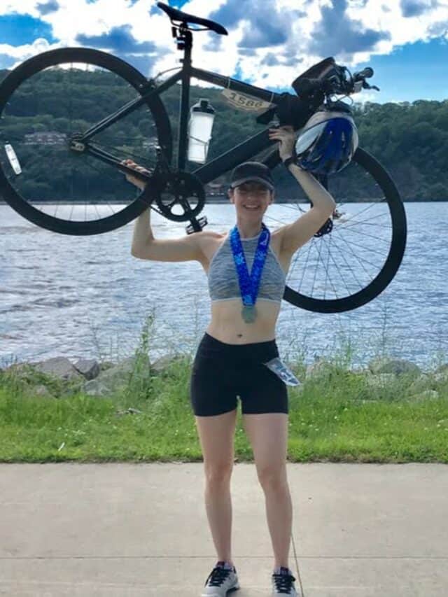 image of brittany lifting her bike