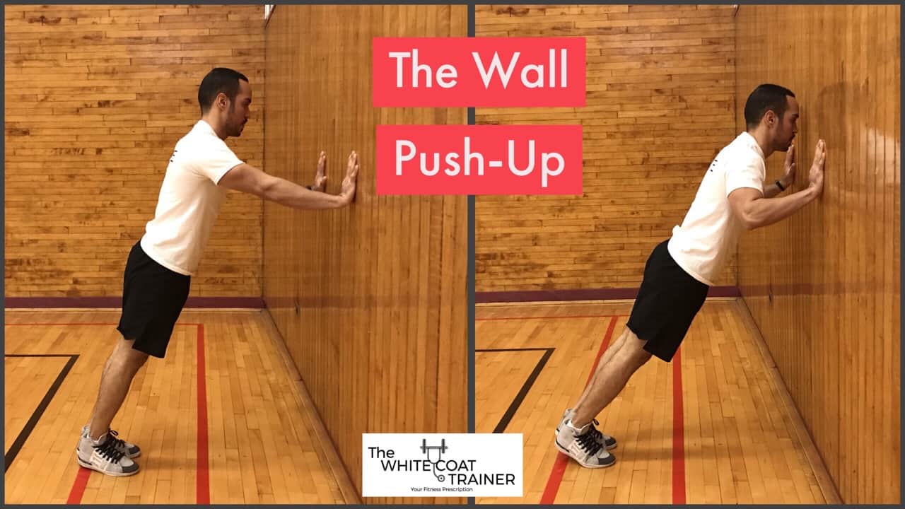 wall pushup: Alex doing a pushup while standing with hands against the wall