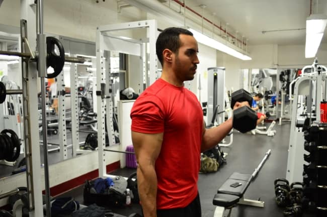 alex doing bicep curls with dumbbells