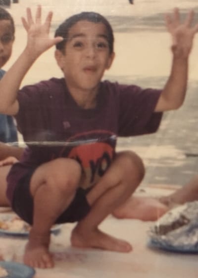 alex showing a perfect squat as a child