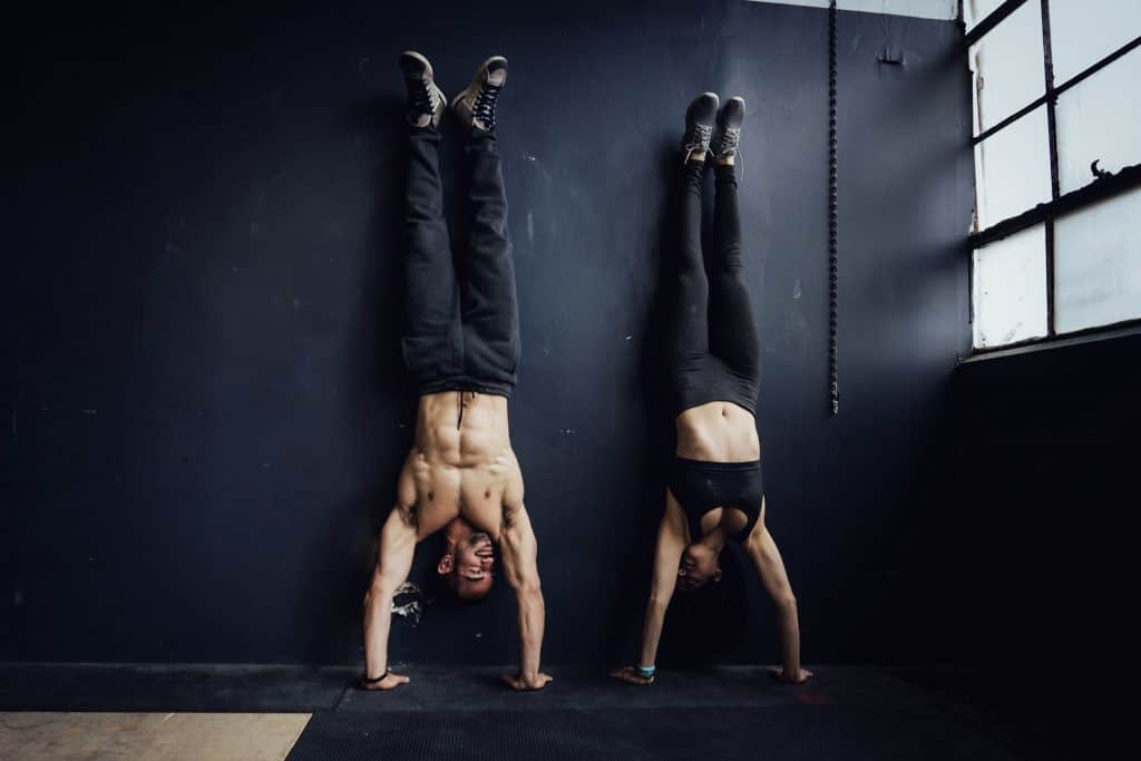 alex and brittany doing a handstand