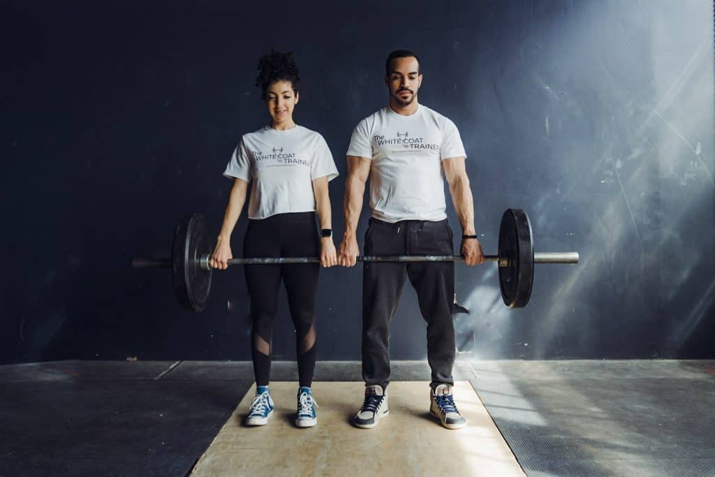 alex and brittany deadlifting a barbell together