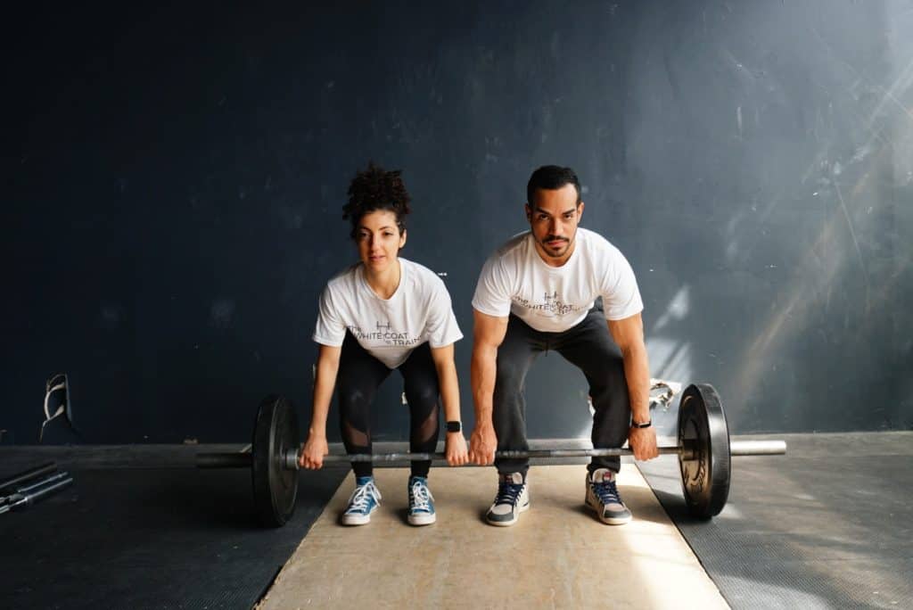 alex and brittany lifting a barbell together