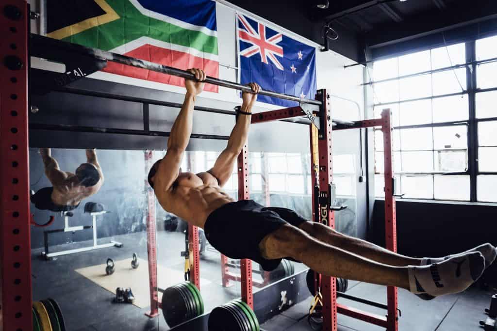 alex doing a front lever, holding his body completely horizontal from a. pull up bar without bending his hips