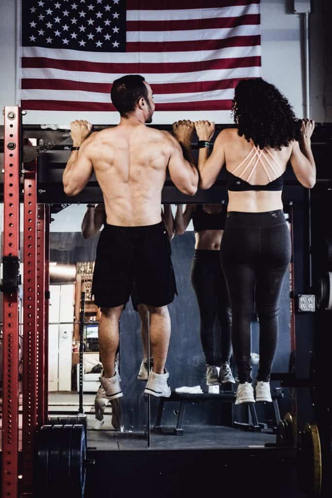 alex and brittany doing a pull-up