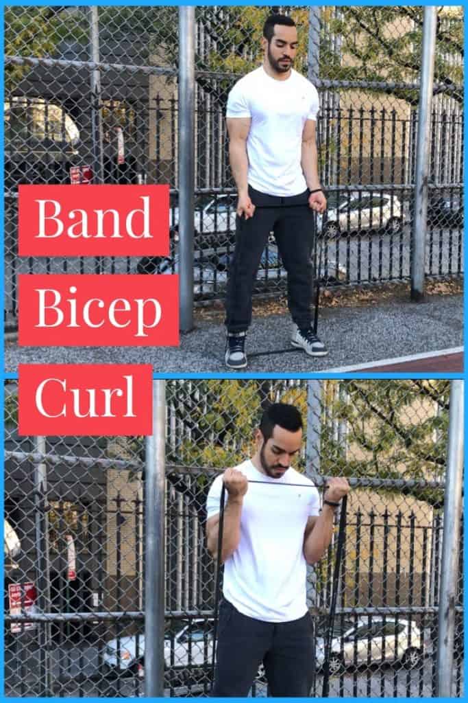 band-exercises-for-arms band bicep curl: alex curling a band up to his chest that is anchored under his feet