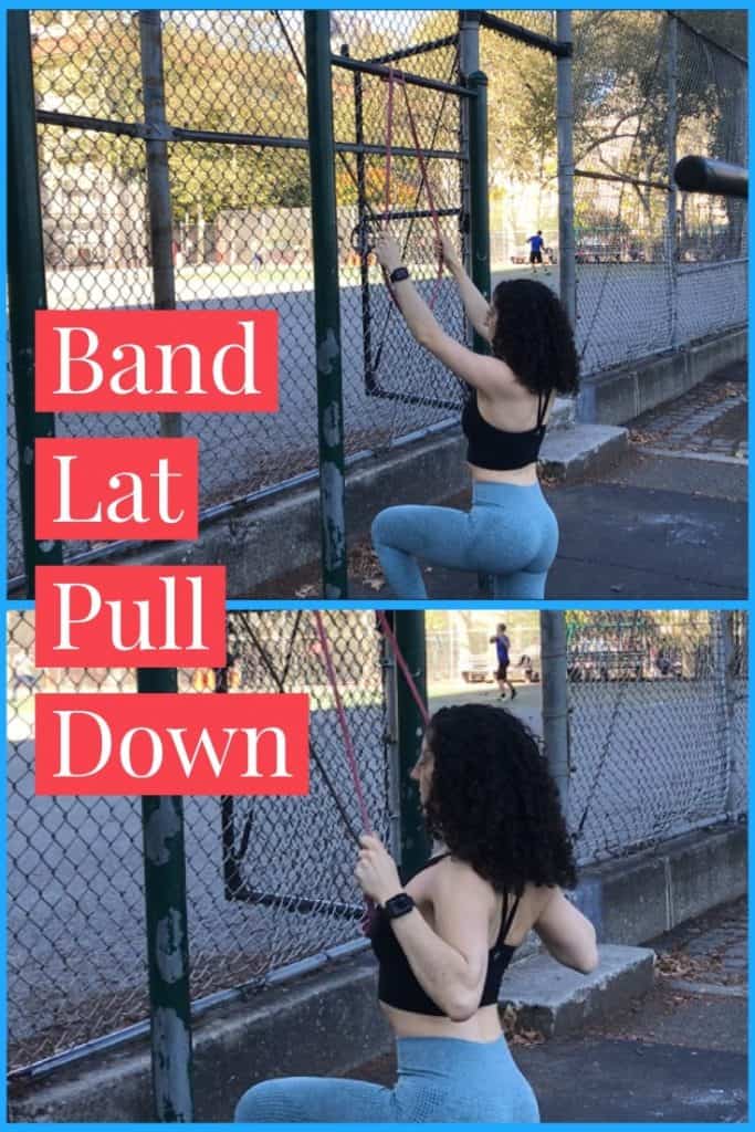 band-lat-pulldown: brittany kneeling and pulling a band straight down that is anchored to a bar above her head