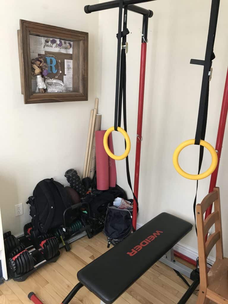 home-gym-setup-pull-up-bar-rings-dumbbells-bench