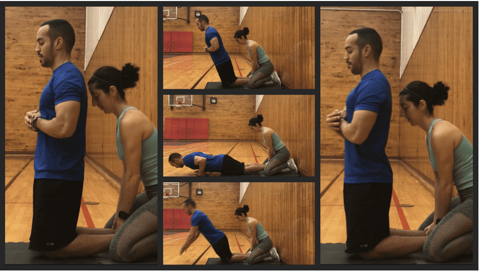 brittany holding alex feet as he performs a nordic hamstring curl